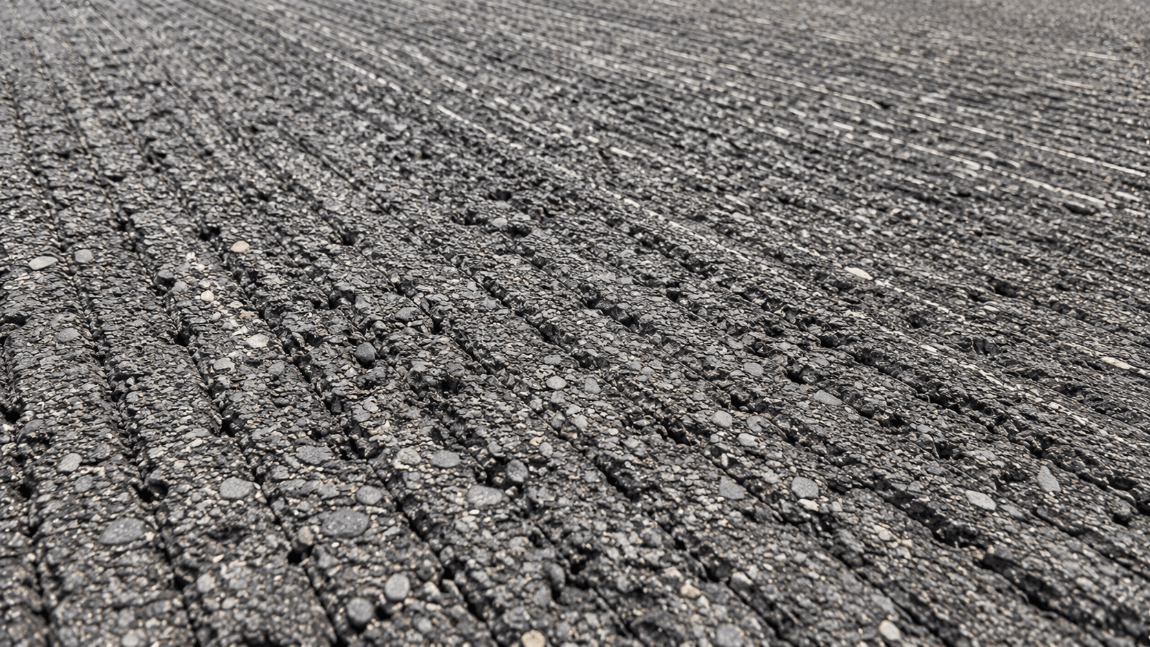Close-up of the textured surface left behind after asphalt milling