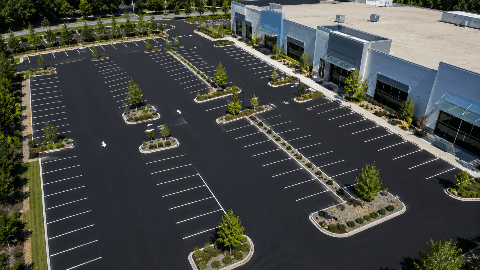 Aerial view of a large, well-maintained commercial asphalt parking lot