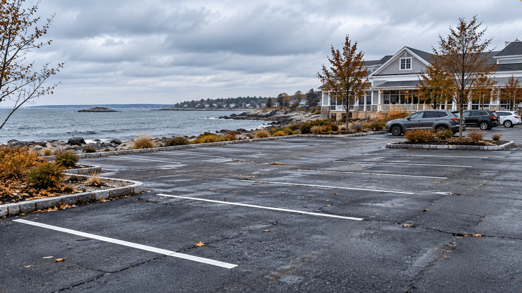 Commercial parking lot along the Connecticut shoreline with Long Island Sound visible